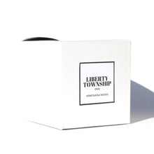 White candle box for a 10 oz. local candle. The Liberty Township, Ohio 10 ounce candle smells like honeysuckle and woodsy notes.